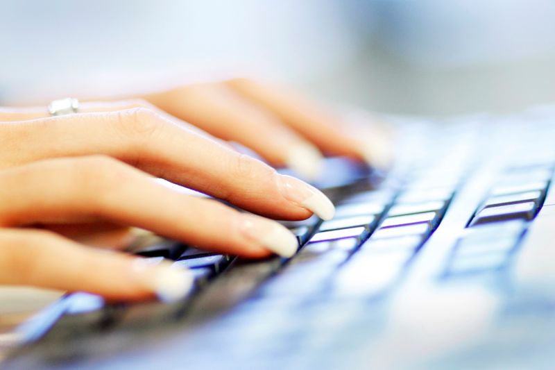 FILE PHOTO: A woman uses a computer keyboard in this