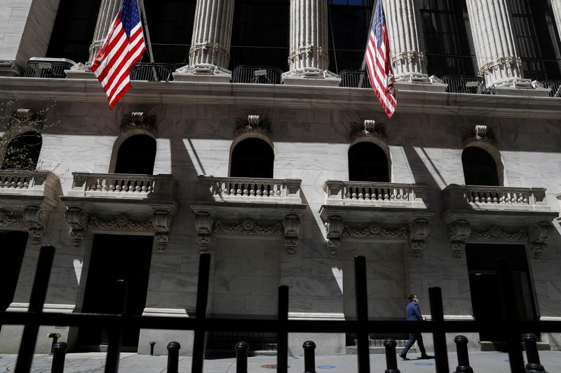 A trader walks outside the New York Stock Exchange in