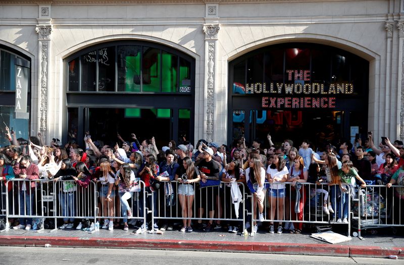 FILE PHOTO: Fans line up along a closed Hollywood Blvd.