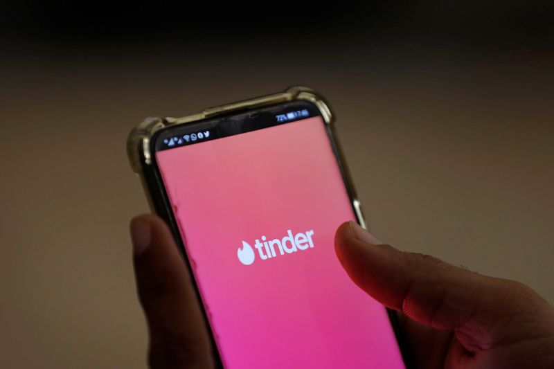 The dating app Tinder is shown on a mobile phone