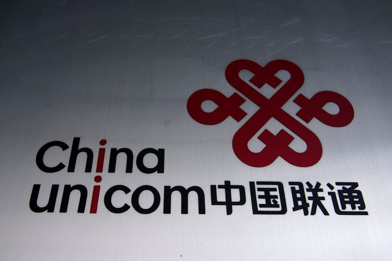 A sign of China Unicom is seen on a street,