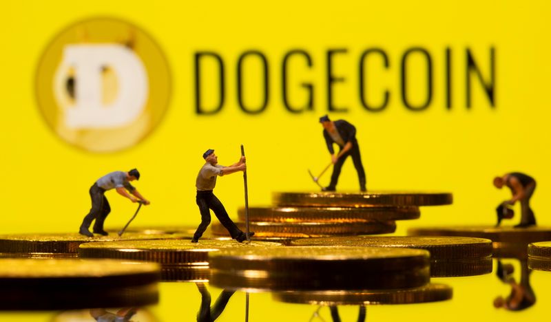 Small toy figures are seen on the cryptocurrency representation with