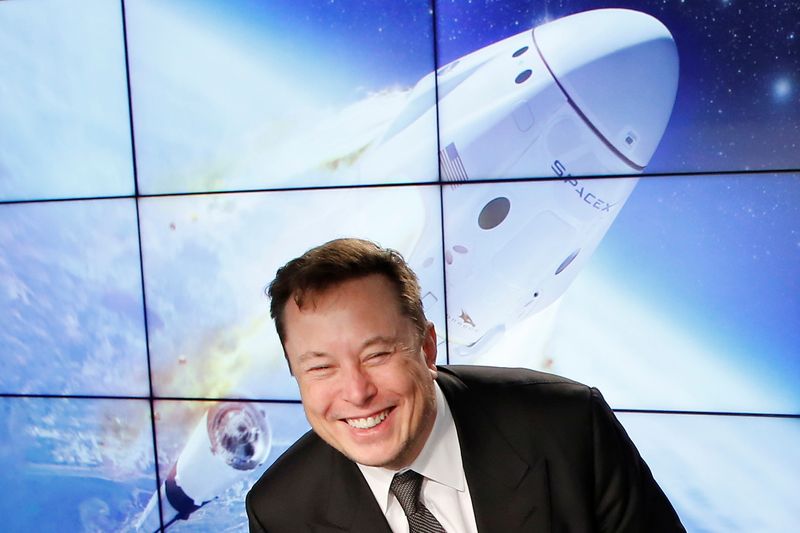 FILE PHOTO: SpaceX founder and chief engineer Elon Musk reacts