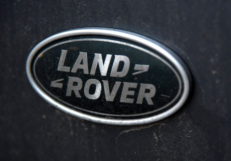 A Land Rover badge is seen on a four wheel