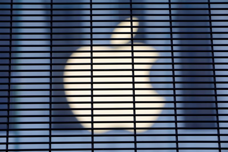 FILE PHOTO: The Apple logo is seen through a security
