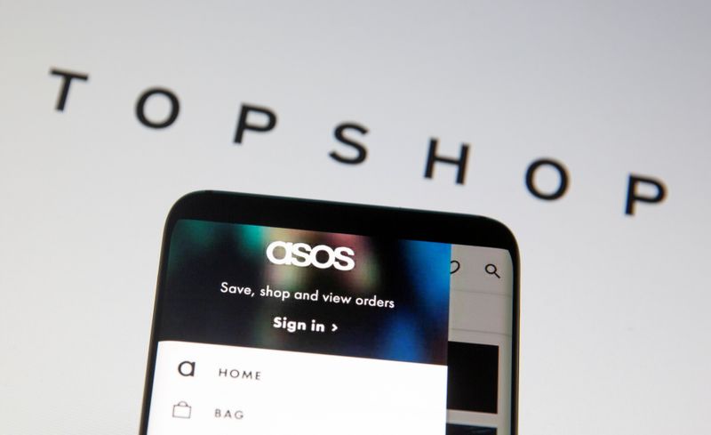 FILE PHOTO: Asos logo is seen in a smartphone in