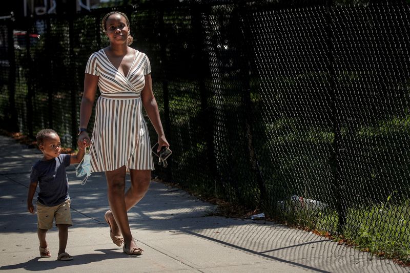 FILE PHOTO: Chantel Springer walks with her son Jasiah in