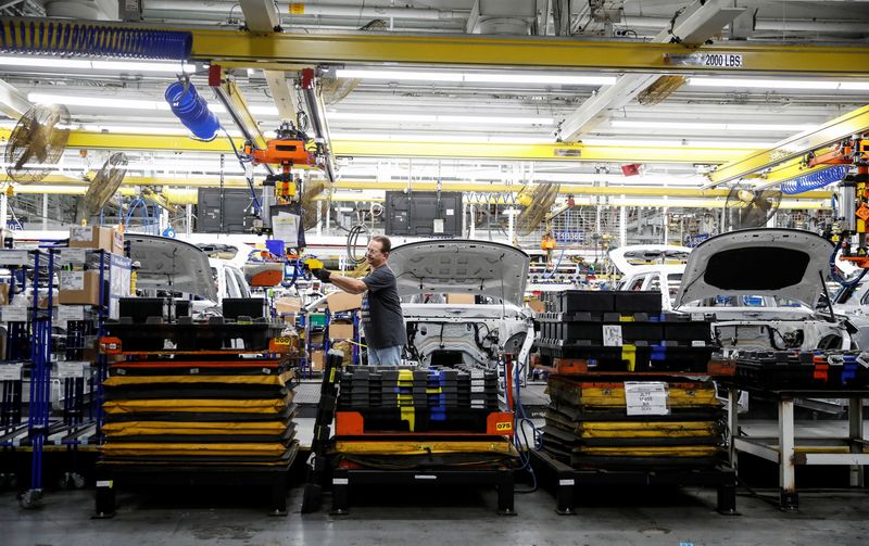 FILE PHOTO: A worker builds a 2020 Ford Explorer car