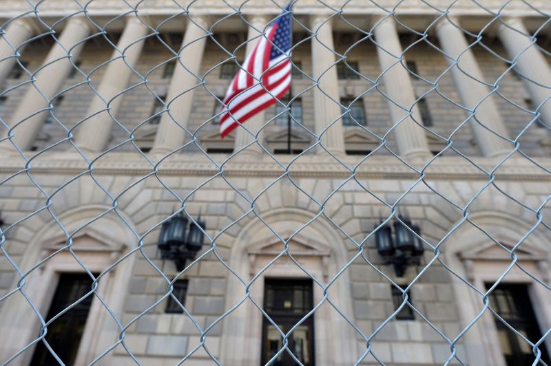 FILE PHOTO: A fence surrounds the U.S. Department of Commerce