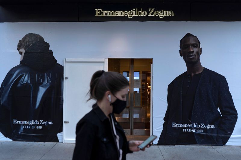 Plywood covers the window of an Ermenegildo Zegna store in