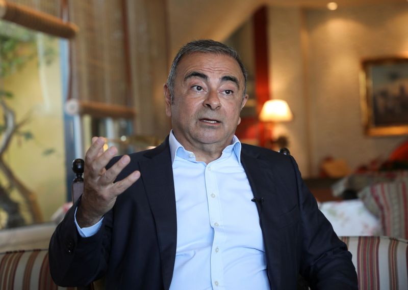 Former Nissan Chairman Carlos Ghosn talks during an interview with