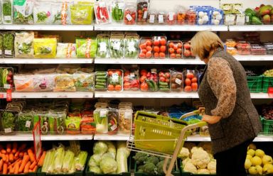 FILE PHOTO: Customer shops at Victoria supermarket operated by Russian
