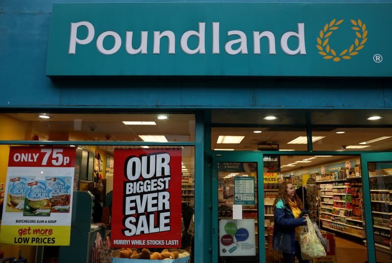 FILE PHOTO: A woman leaves a branch of Poundland in