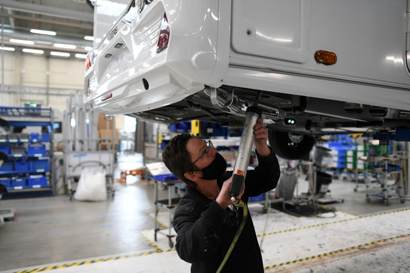 FILE PHOTO: Worker assembles a vehicle at the Knaus-Tabbert AG