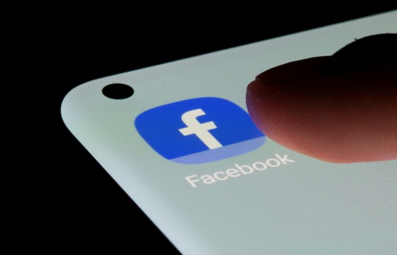 FILE PHOTO: Facebook app is seen on a smartphone in