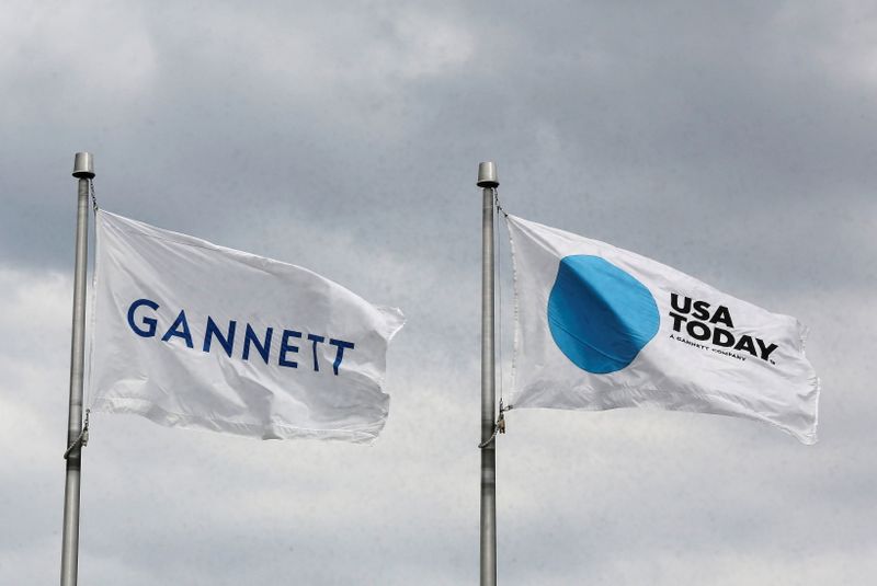 FILE PHOTO: The corporate flags for the Gannett Co and