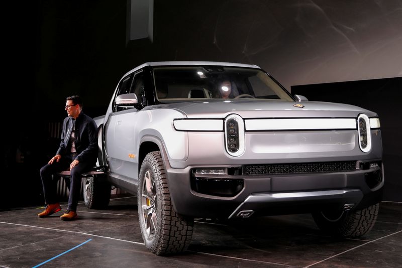 FILE PHOTO: Rivian’s CEO, Scaringe, with the R1T all-electric pickup