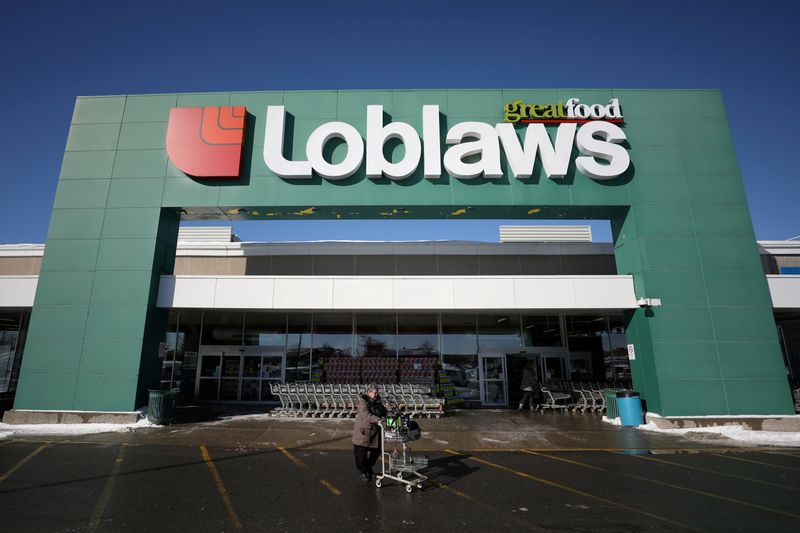 FILE PHOTO: A shopper leaves a Loblaw grocery store in