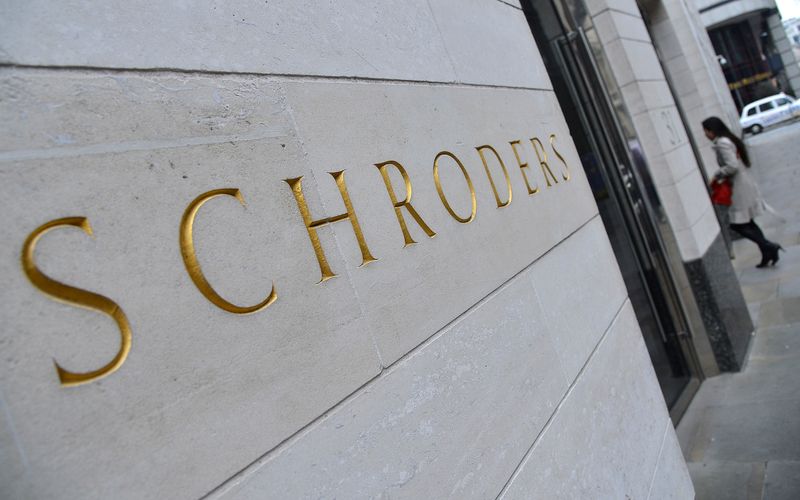 FILE PHOTO: A Schroders sign is seen outside a building