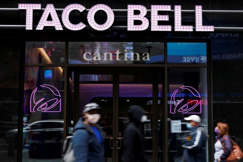 FILE PHOTO: People walk by Taco Bell’s first digital-only U.S.