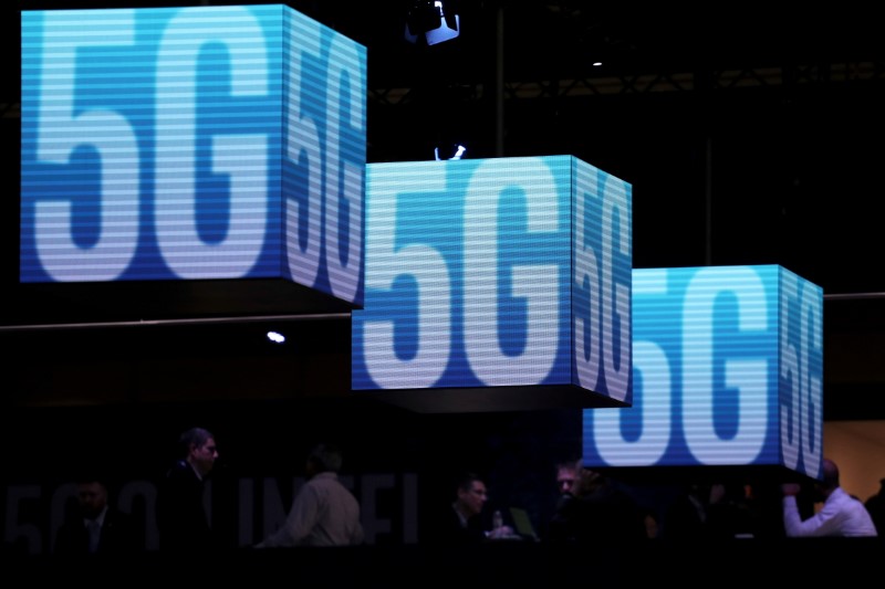FILE PHOTO: Hanging cubes display 5G logo at the Mobile
