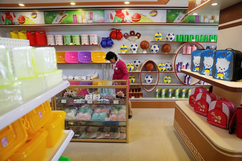 A vendor is pictured in a shop in a newly