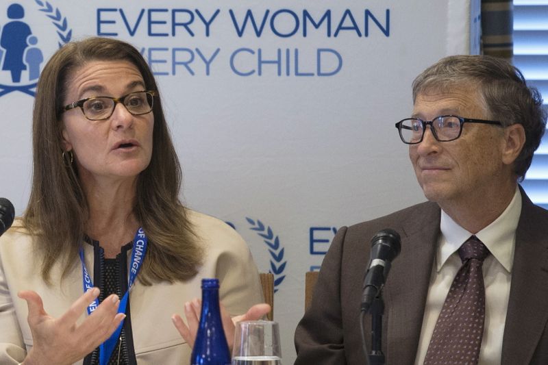 FILE PHOTO: Melinda Gates and her husband attend a news
