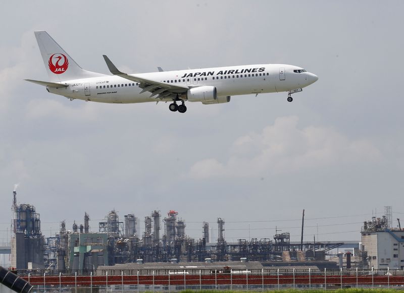 JAL’s airplane flies nearby Haneda Airport in Tokyo