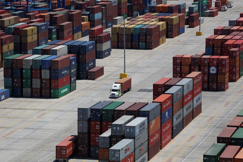 FILE PHOTO: Shipping containers are stacked for storage at Wando