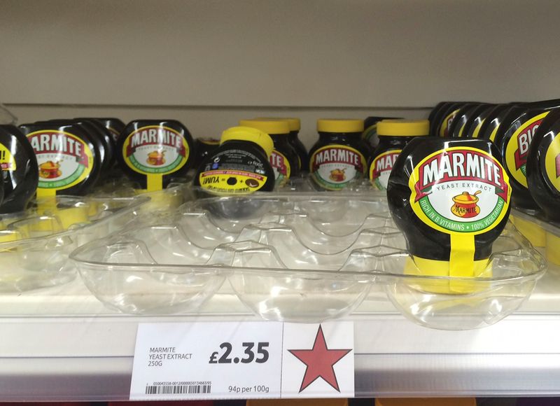 Jars of Marmite, a brand of Unilever, are displayed for