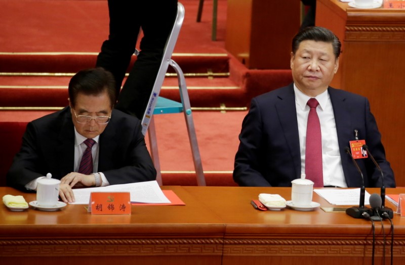 FILE PHOTO: Chinese President Xi Jinping and former President Hu
