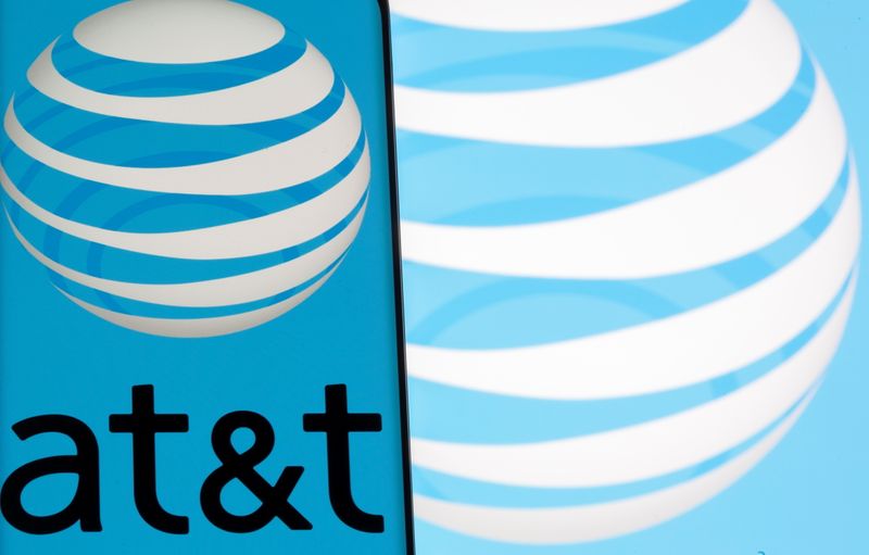 AT&T logo is seen on a smartphone in front of