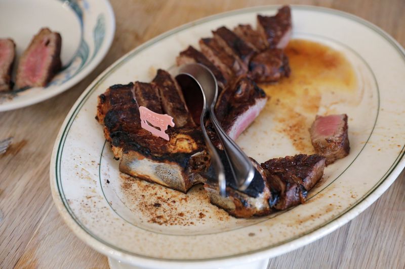 A serving of steak is seen at Peter Luger Steak