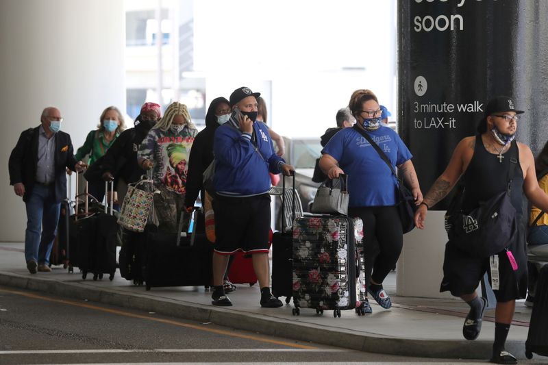 FILE PHOTO: Passengers queue at LAX airport before Memorial Day