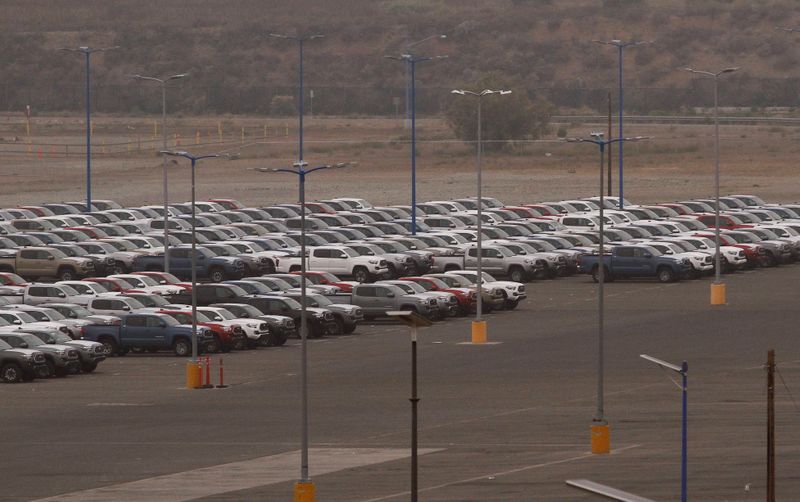 Newly assembled vehicles are parked at the Toyota Motor Manufacturing