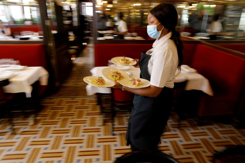 FILE PHOTO: Restaurants reopen indoor dining rooms with an easing