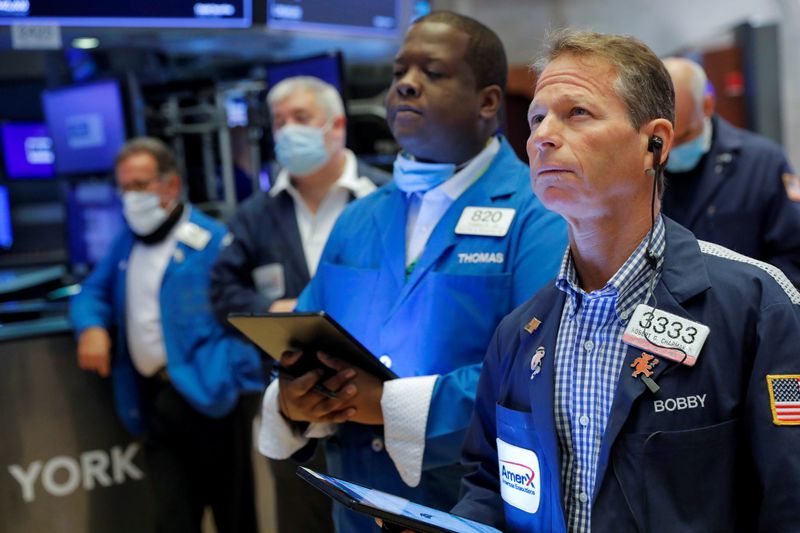 Traders work on the floor at the New York Stock