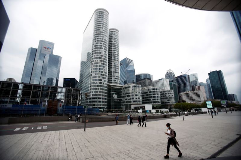 FILE PHOTO: People walk through the financial and business district