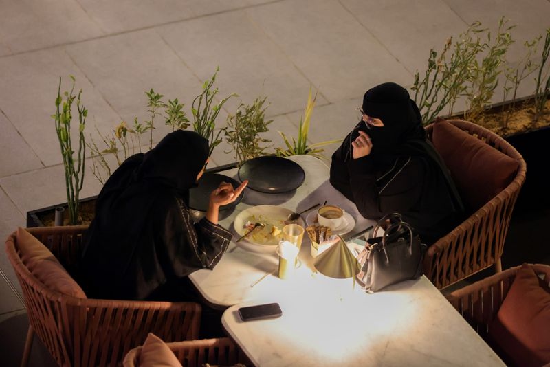 Saudi women sit at David Burke’s restaurant, in The Zone