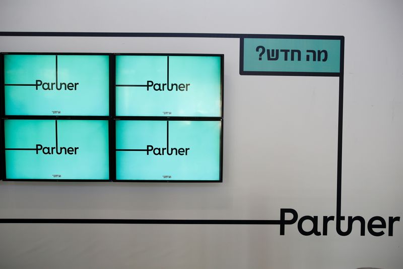 FILE PHOTO: Screens displaying the logo of Partner, an Israeli