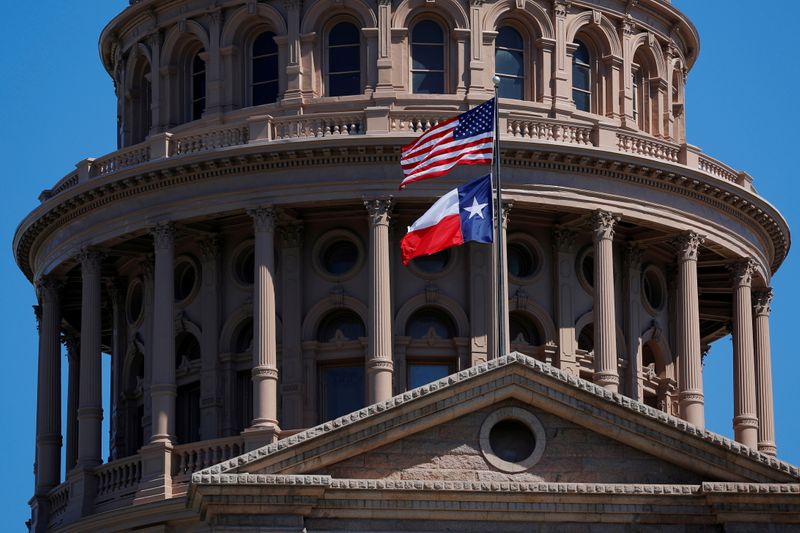 FILE PHOTO: The U.S flag and the Texas State flag