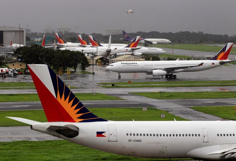 FILE PHOTO: Philippine Airlines planes are seen parked on tarmac