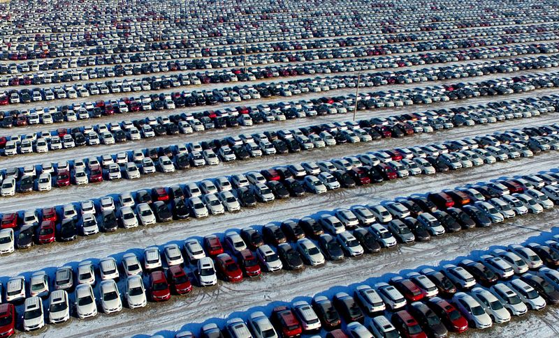 New cars are seen at a parking lot in Shenyang