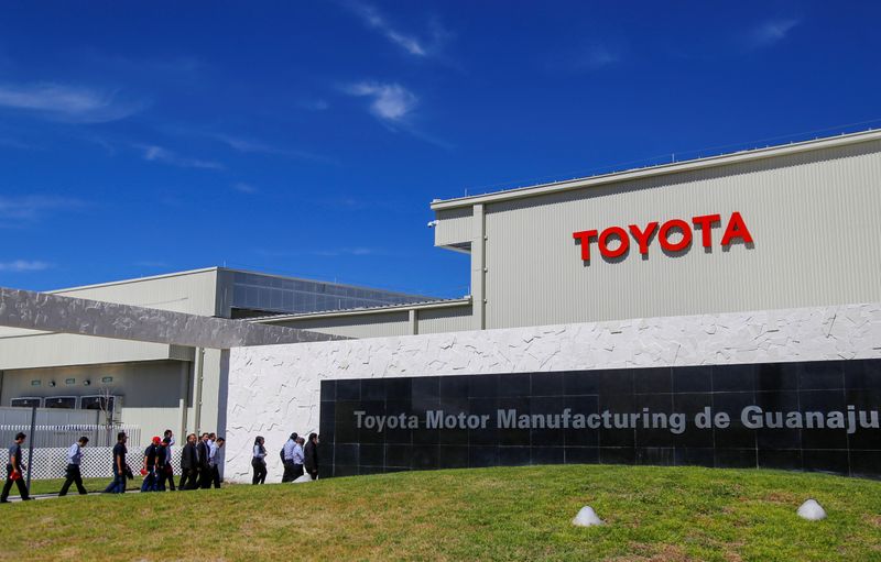 Employees walk at the Toyota Motor Corp new plant in