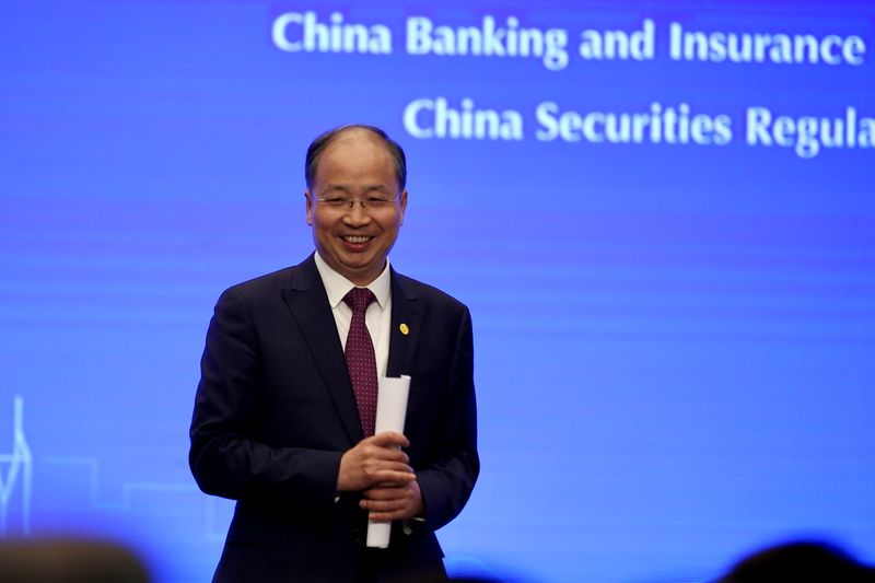 FILE PHOTO: Chairman of China Securities Regulatory Commission (CSRC) Yi