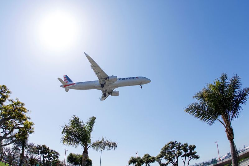 An American Airlines passenger jet approaches to land at LAX