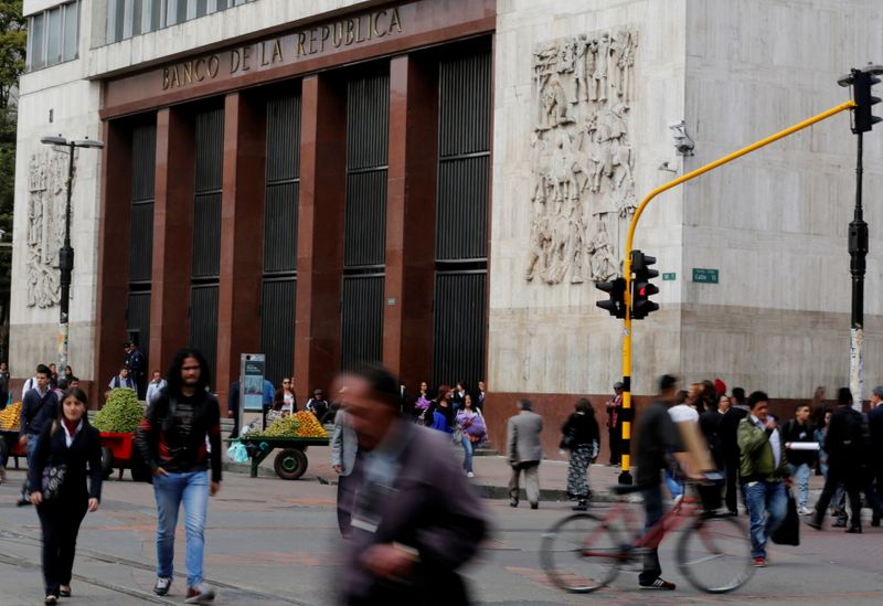 FILE PHOTO: People walk past Colombia’s central bank in Bogota