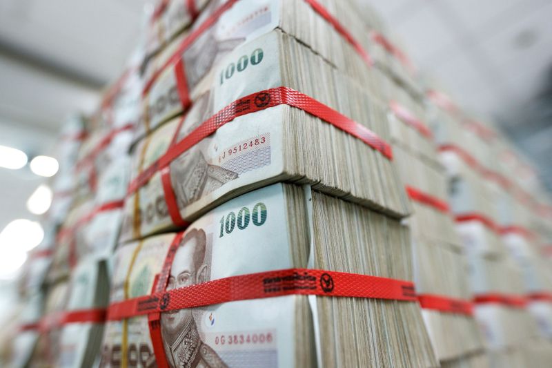 FILE PHOTO: Thai baht notes are seen at a Kasikornbank