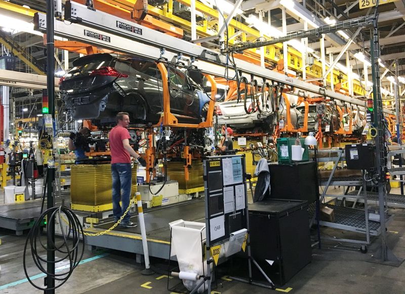FILE PHOTO: Workers assemble Chevy Bolt EV cars at the