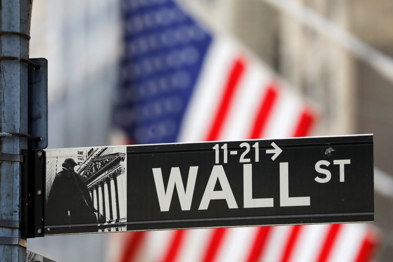 A street sign for Wall Street is seen outside the